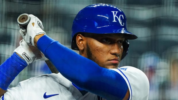 Sep 3, 2020; Kansas City, Missouri, USA; Kansas City Royals left fielder Edward Olivares (14) warms up before batting against the Chicago White Sox at Kauffman Stadium. Mandatory Credit: Jay Biggerstaff-USA TODAY Sports